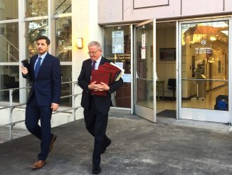Michael Airo, left, a former Ohlone Elementary School teacher accused of molesting his ex-girlfriend’s daughter for three years, leaves the Palo Alto courthouse yesterday with his defense attorney, Michael Armstrong. Post photo by Allison Levitsky.