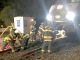 Menlo Park firefighters work to remove a 1950s-era Austin Healey convertible from the front of a Caltrain at the Watkins Avenue crossing Saturday night. Photo provided by the Menlo Park Fire Protection District.