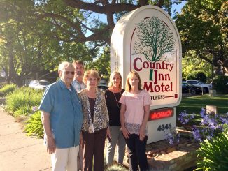 Linda Maher, second from right, stands with her uncle Jim Cesano, mother Rena Gretz and siblings Jim Gretz and Laurie Tinker. The family runs the Country Inn Motel, one of the Palo Alto motels sued by disability access litigant Scott Johnson this year. Post photo by Allison Levitsky.