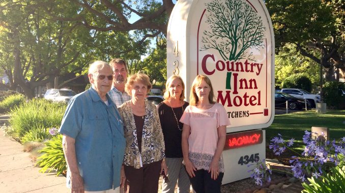 Linda Maher, second from right, stands with her uncle Jim Cesano, mother Rena Gretz and siblings Jim Gretz and Laurie Tinker. The family runs the Country Inn Motel, one of the Palo Alto motels sued by disability access litigant Scott Johnson this year. Post photo by Allison Levitsky.
