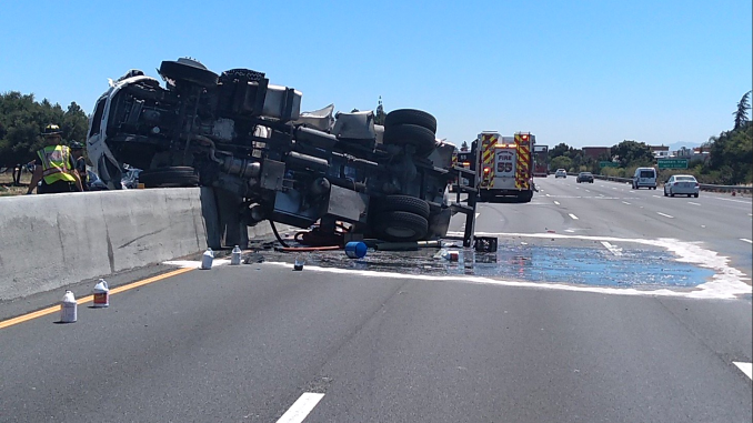 This truck carrying human waste from Porta Potties crashed yesterday on Highway 101 in Palo Alto near the San Antonio Road off-ramp. CHP photo.