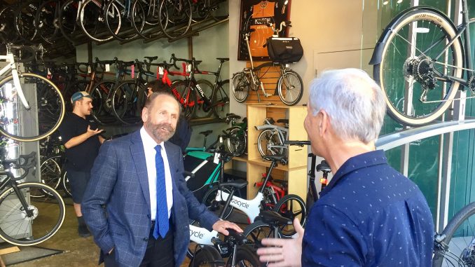 At left, State Sen. Jerry Hill, a San Mateo Democrat who represents the mid-Peninsula, visited Palo Alto Bicycles on University Avenue in this May 11, 2018 Post file photo.