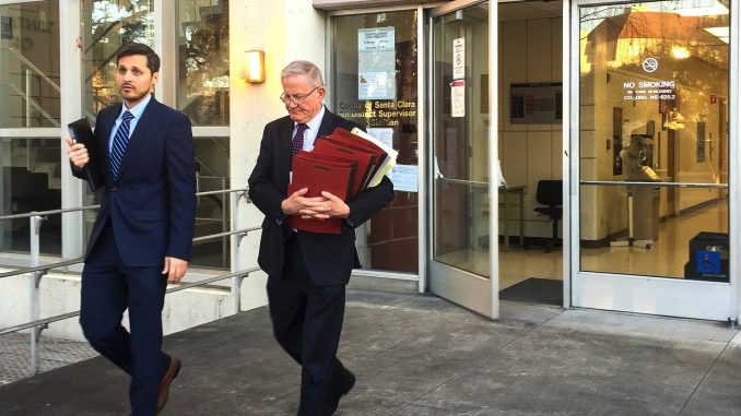 Michael Airo, left, a former Ohlone Elementary School teacher accused of molesting his ex-girlfriend’s daughter for three years, leaves the Palo Alto courthouse yesterday with his defense attorney, Michael Armstrong. Post photo by Allison Levitsky.