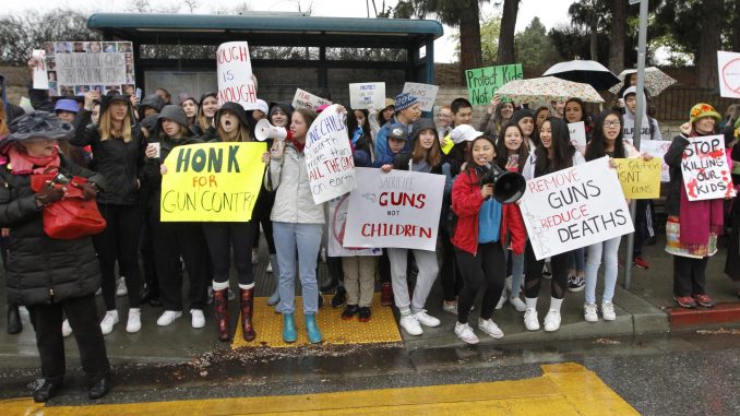 Hundreds of Gunn High School students and parents demonstrate for gun control across the street of the main entrance of Gunn this morning (Feb. 26). Photo by Paul Sakuma of Paul Sakuma Photography, www.PaulSakuma.com