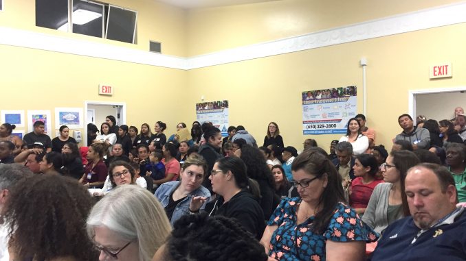 The Ravenswood City School District board room had an overflow crowd for Thursday night's meeting. Post photo by Emily Mibach.