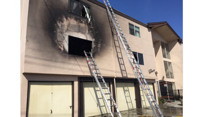 A two-alarm fire struck this apartment house at 2411 Middlefield Road today (May 19). Photo from Redwood City Fire Department via Twitter.