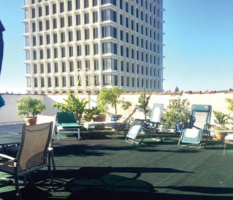 Hotel President tenants use this rooftop patio. In the background is the 15-story 525 University office tower.