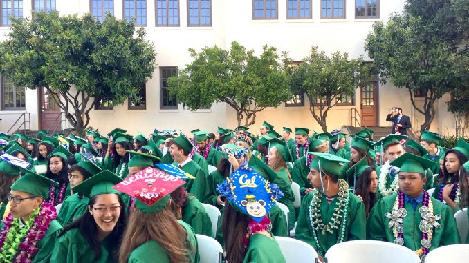 Students await the presentation of their diplomas at Palo Alto High School. Post photo by Allison Levitsky.
