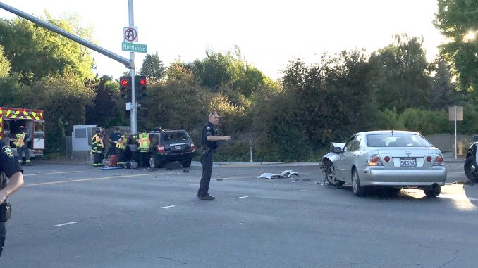 Palo Alto police and firefighter-paramedics responded to a two-car crash at the intersection of Middlefield Road and Oregon Expressway at about 7:45 p.m. tonight (June 13). Medics attended to one person in the SUV that crashed into the stoplight pole, but there was no immediate information on the extent of injuries. Post photo.