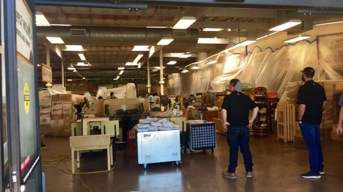 Workers clean up Sprouts Farmers Market in Mountain View following a fire on Friday. Post photo by Allison Levitsky.