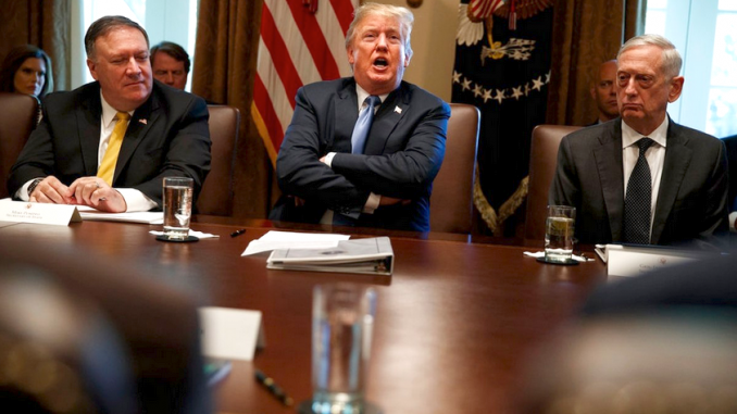 Secretary of State Mike Pompeo, left, and Secretary of Defense Jim Mattis, right, listen as President Trump speaks during a cabinet meeting at the White House on June 21, 2018. AP photo.