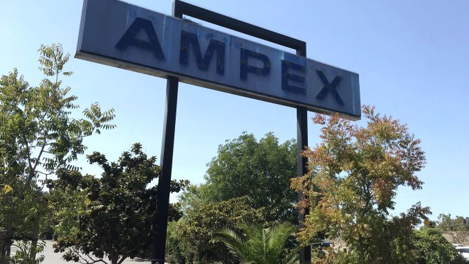 Crews have removed the white letters from the Ampex sign along Highway 101 in Redwood City. The sign will be removed this week. Post photo.