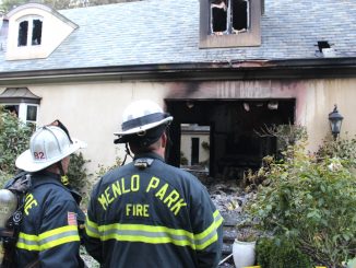 Firefighters look at the damage to a home at 11 Robert S Drive in Menlo Park. Photo courtesy of the Menlo Park Fire Protection District.